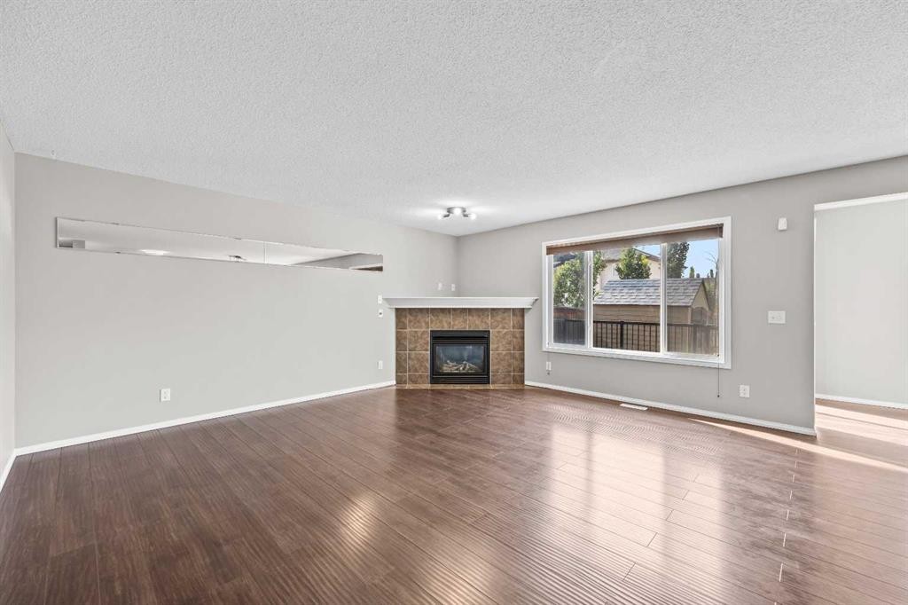 140 West Creek Circle, Chestermere, AB - Indoor Photo Showing Living Room With Fireplace