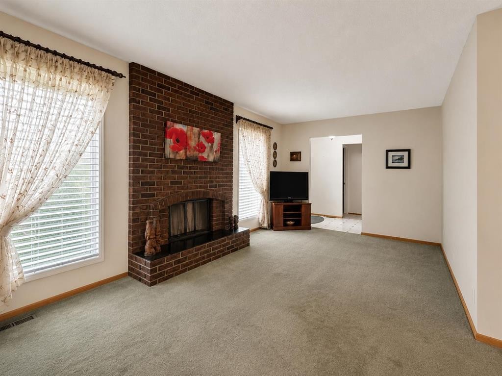 3135 60 Street Ne, Calgary, AB - Indoor Photo Showing Living Room With Fireplace