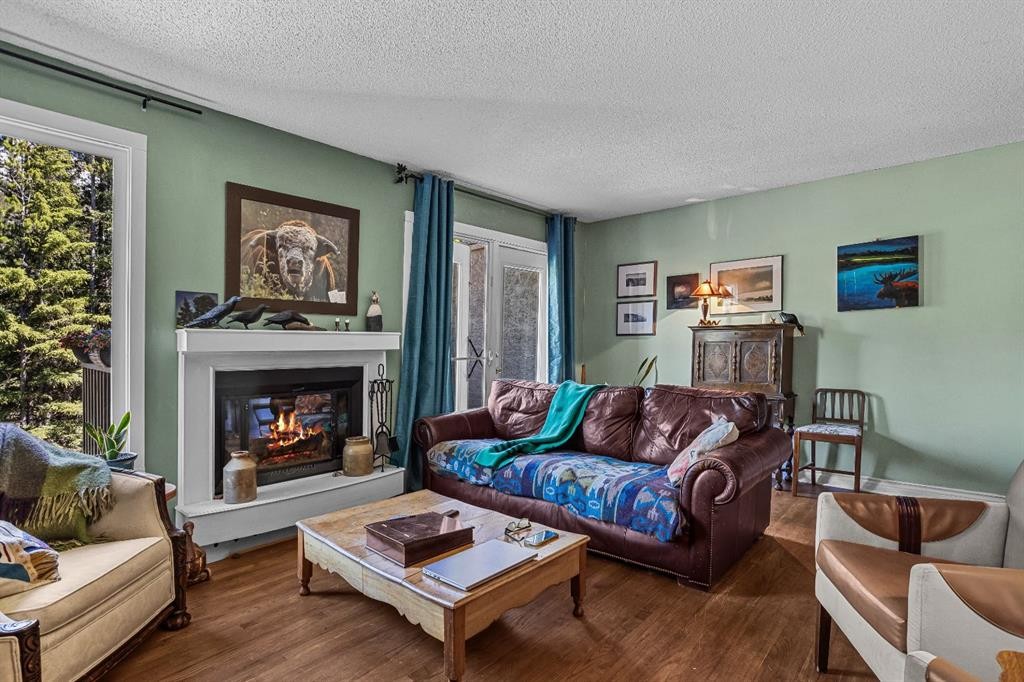 246 Kluane Drive, Banff, AB - Indoor Photo Showing Living Room With Fireplace