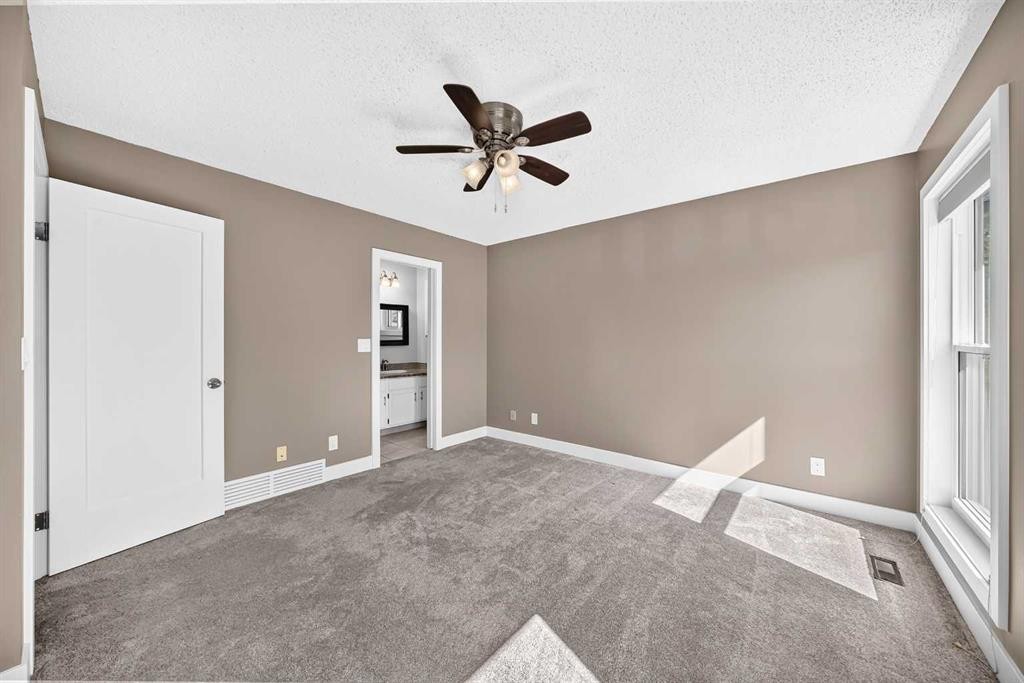 12 Sunvale Mews Se, Calgary, AB - Indoor Photo Showing Other Room