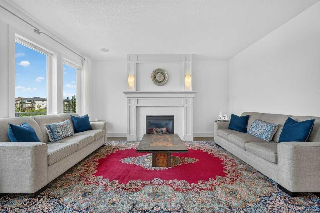 232 Copperpond Circle Se, Calgary, AB - Indoor Photo Showing Living Room With Fireplace