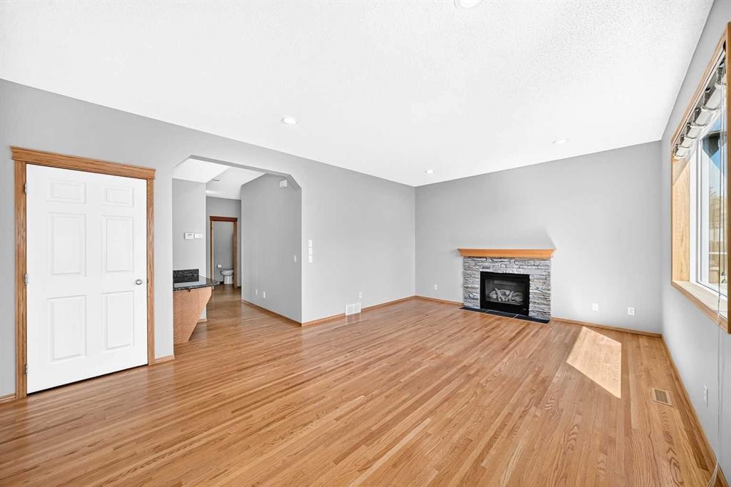 83 Edgeridge Close Nw, Calgary, AB - Indoor Photo Showing Other Room With Fireplace