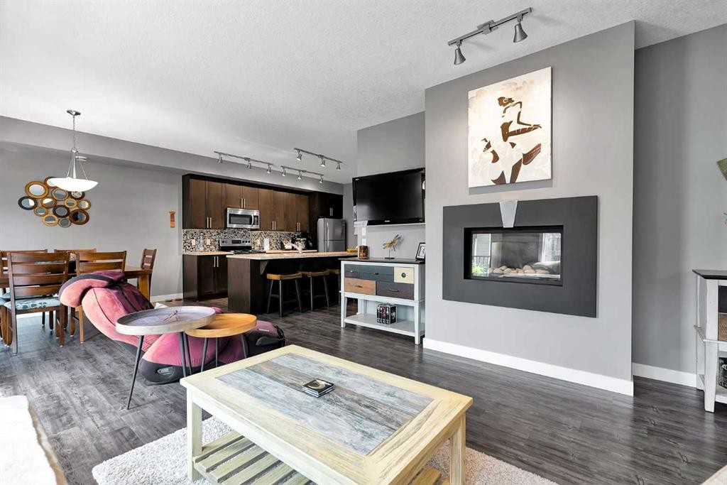 410 Cranford Walk Se, Calgary, AB - Indoor Photo Showing Living Room With Fireplace