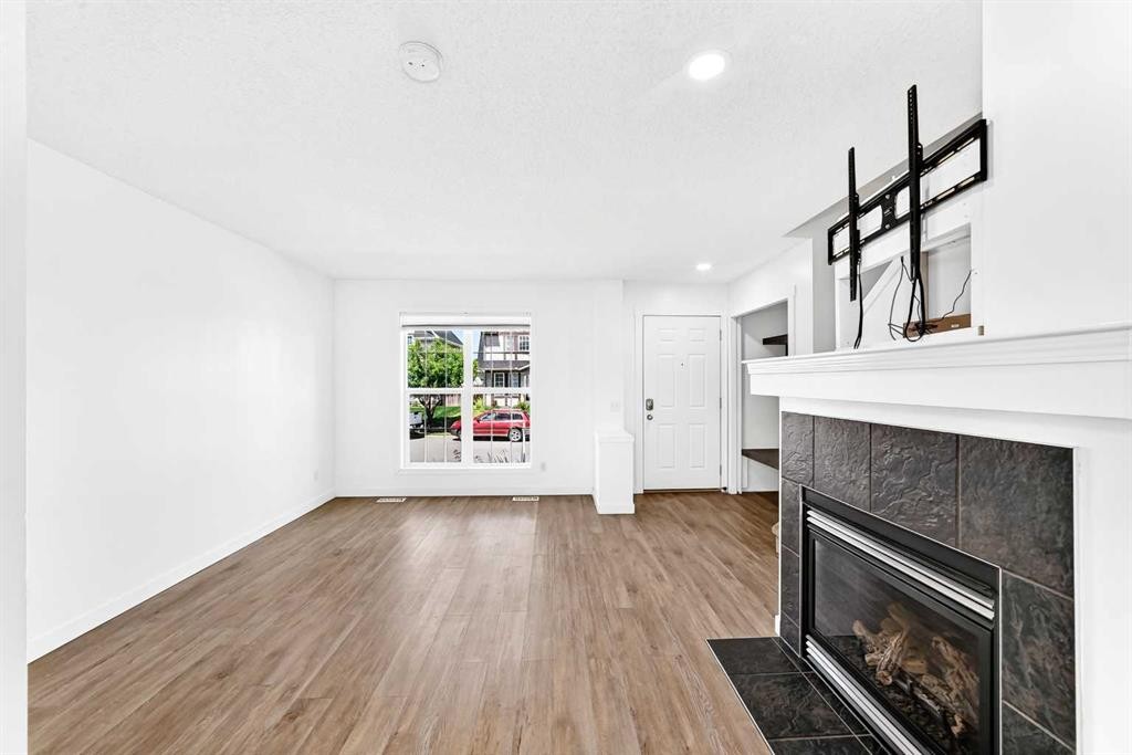 294 Elgin View Se, Calgary, AB - Indoor Photo Showing Living Room With Fireplace