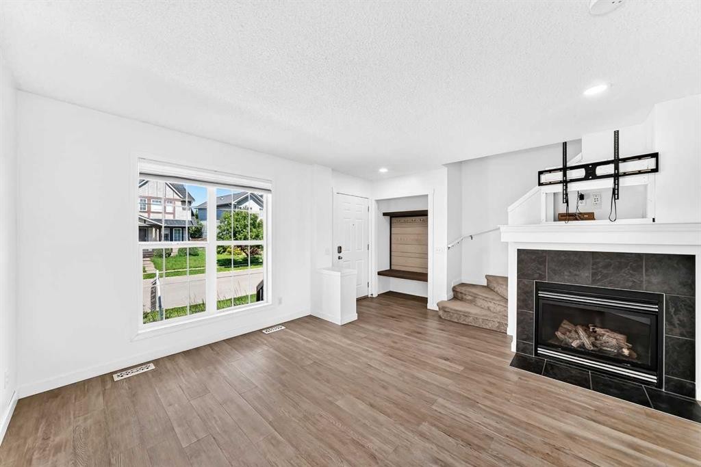 294 Elgin View Se, Calgary, AB - Indoor Photo Showing Living Room With Fireplace