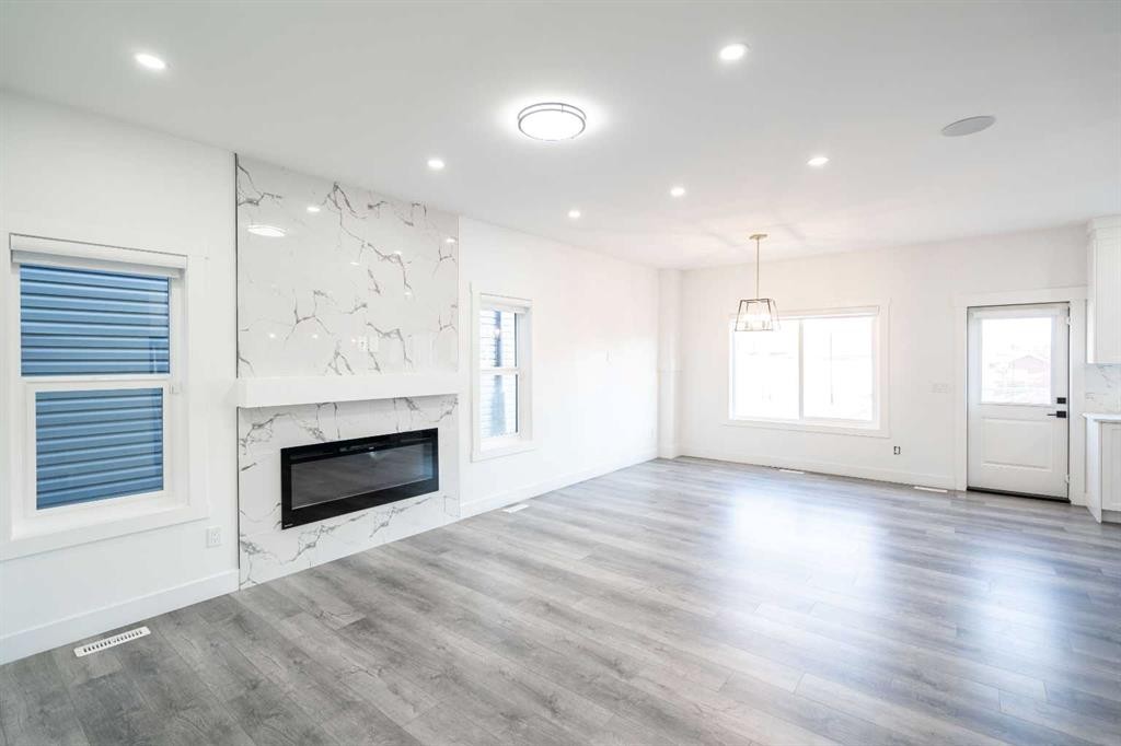 123 Saddlecrest Grove Ne, Calgary, AB - Indoor Photo Showing Living Room With Fireplace