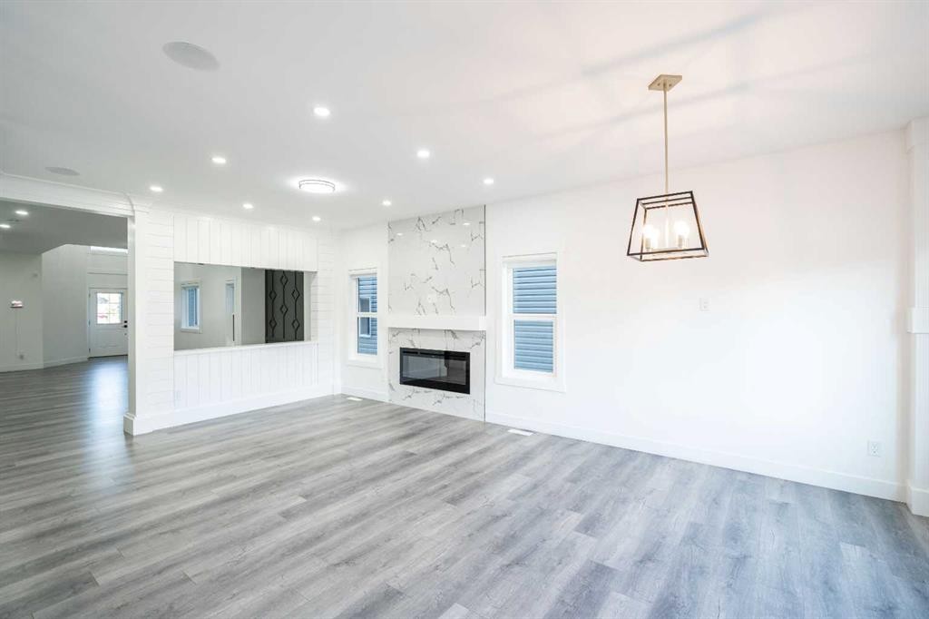 123 Saddlecrest Grove Ne, Calgary, AB - Indoor Photo Showing Living Room With Fireplace