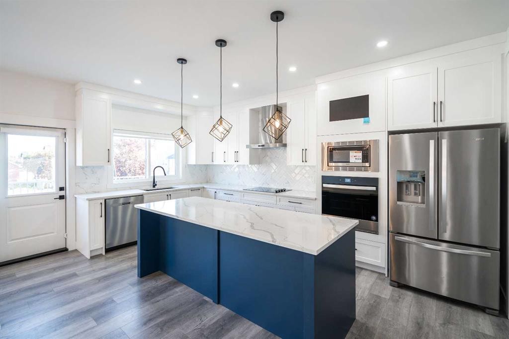 123 Saddlecrest Grove Ne, Calgary, AB - Indoor Photo Showing Kitchen With Stainless Steel Kitchen With Upgraded Kitchen