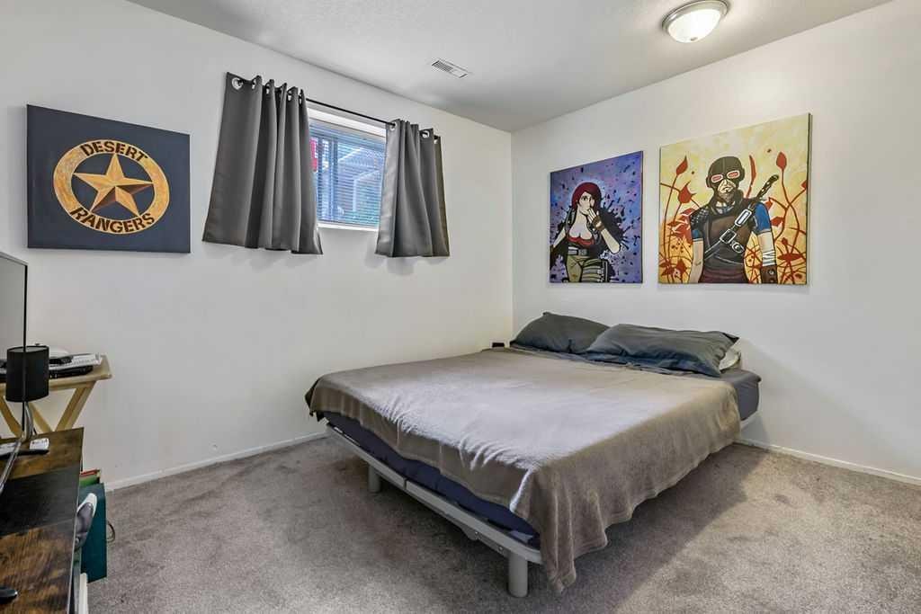 311 Penbrooke Crescent Se, Calgary, AB - Indoor Photo Showing Bedroom