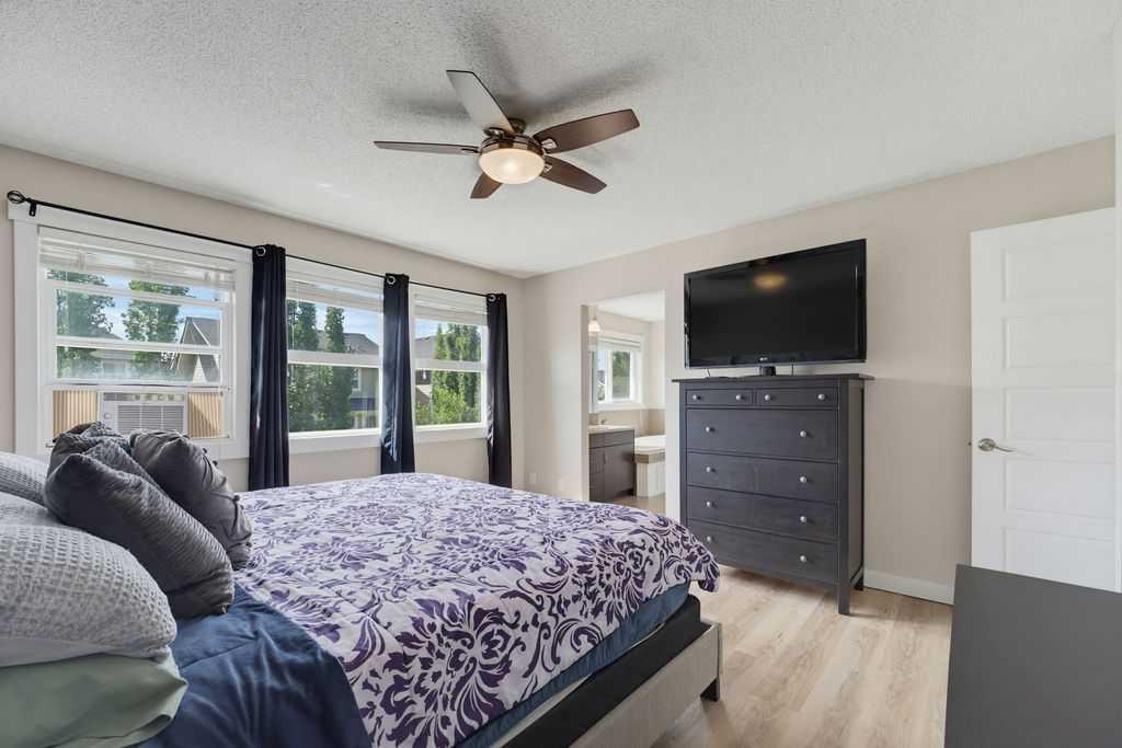145 Sunset Manor, Cochrane, AB - Indoor Photo Showing Bedroom