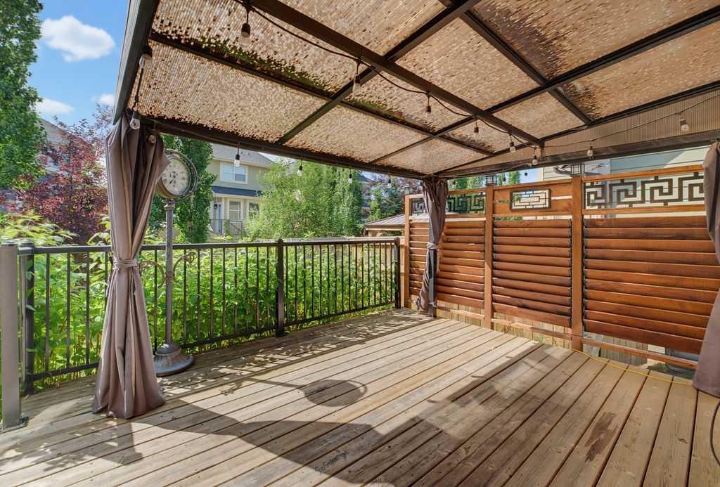 145 Sunset Manor, Cochrane, AB - Outdoor With Deck Patio Veranda With Exterior