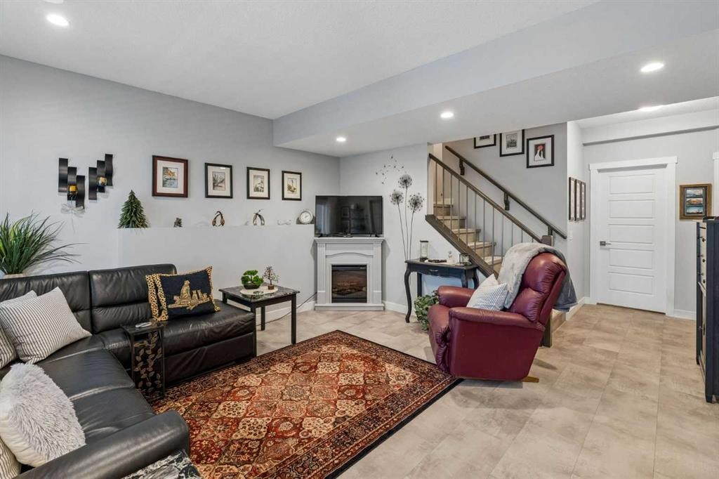 7 Bishop Circle, Carstairs, AB - Indoor Photo Showing Living Room With Fireplace