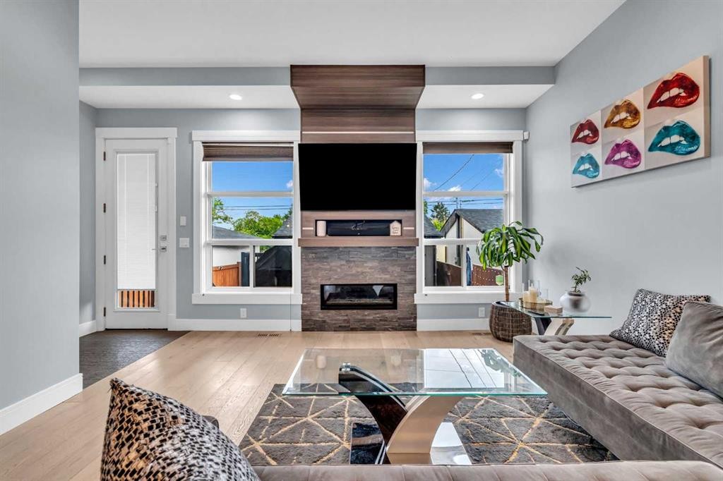 2417 25 Avenue Nw, Calgary, AB - Indoor Photo Showing Living Room With Fireplace