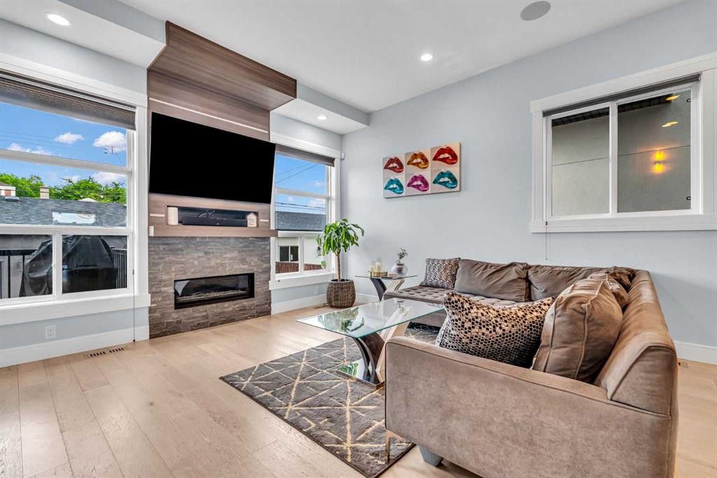 2417 25 Avenue Nw, Calgary, AB - Indoor Photo Showing Living Room With Fireplace