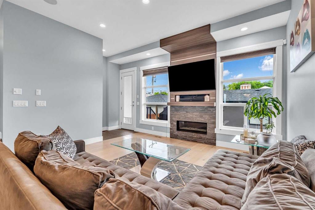 2417 25 Avenue Nw, Calgary, AB - Indoor Photo Showing Living Room With Fireplace