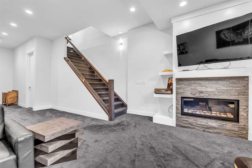 2417 25 Avenue Nw, Calgary, AB - Indoor Photo Showing Living Room With Fireplace