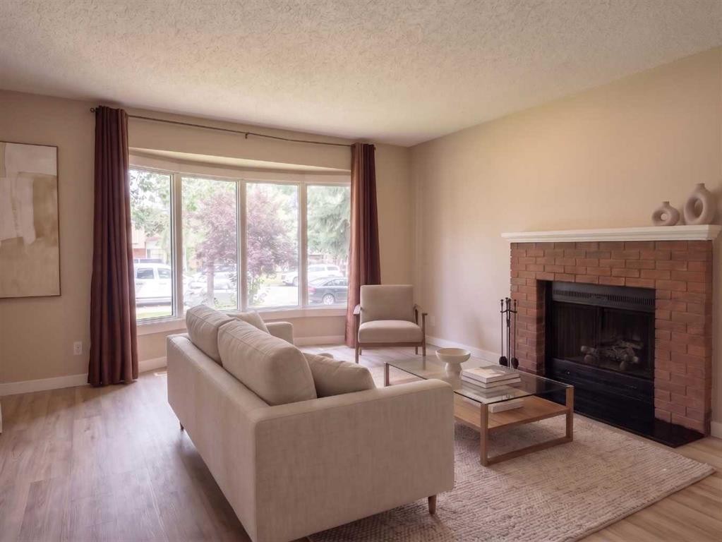 1095 Berkley Drive Nw, Calgary, AB - Indoor Photo Showing Living Room With Fireplace