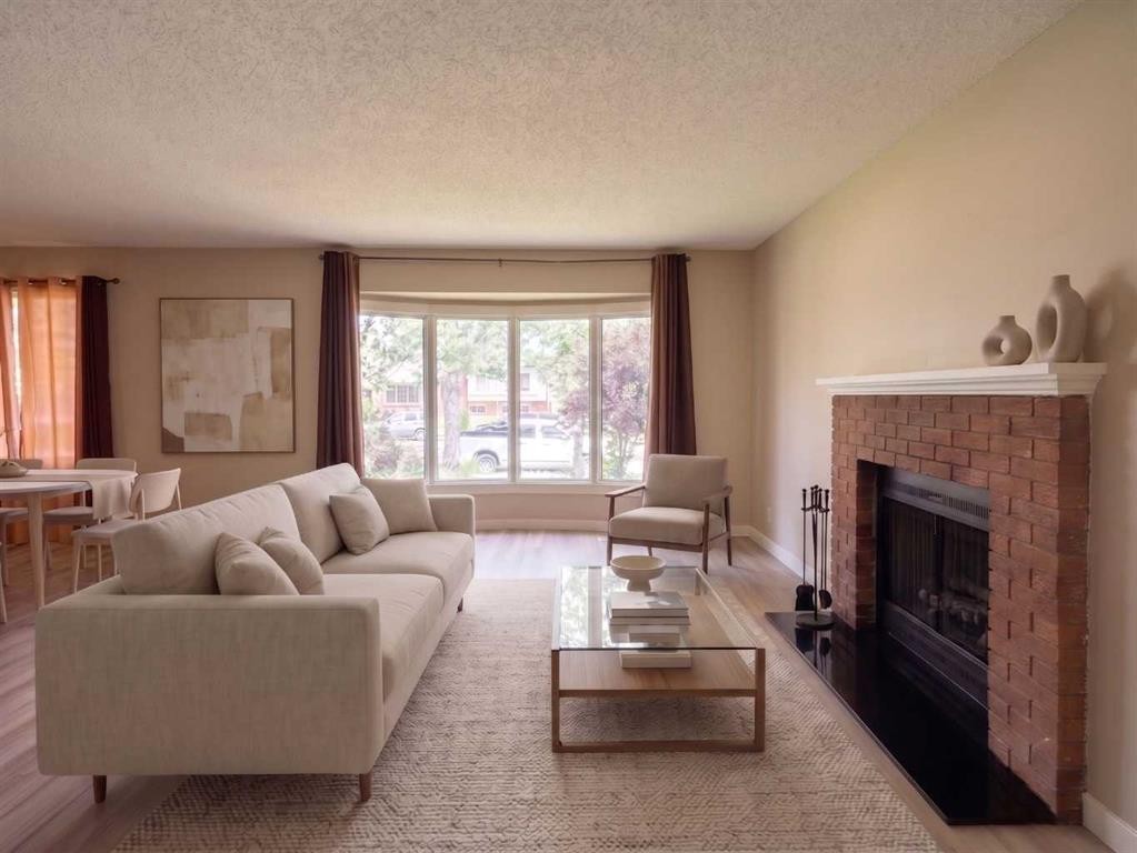 1095 Berkley Drive Nw, Calgary, AB - Indoor Photo Showing Living Room With Fireplace