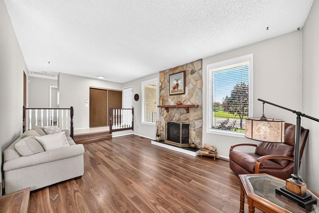108 Falconridge Close Ne, Calgary, AB - Indoor Photo Showing Living Room With Fireplace