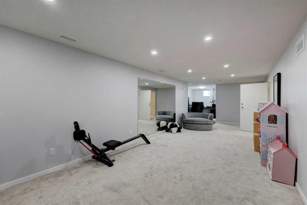 212 Hendon Drive Nw, Calgary, AB - Indoor Photo Showing Gym Room