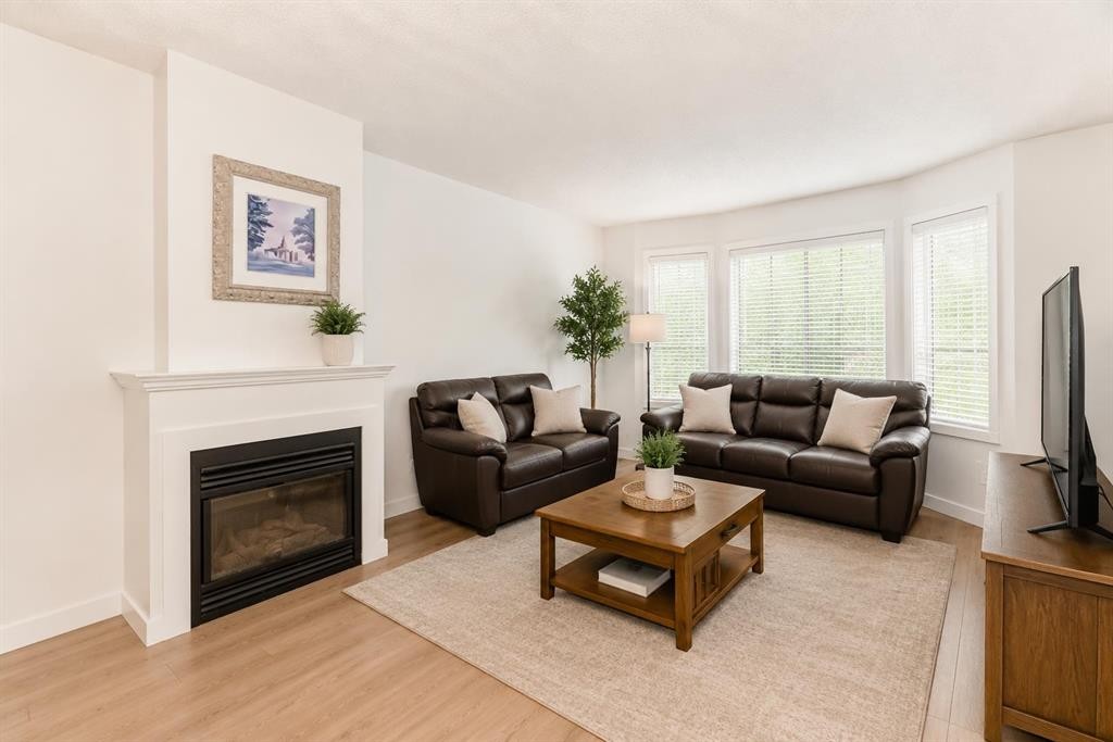 101 Hidden Valley Villas Nw, Calgary, AB - Indoor Photo Showing Living Room With Fireplace