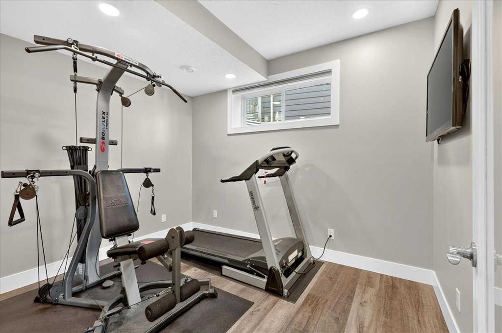 69 Cimarron Springs Circle, Okotoks, AB - Indoor Photo Showing Gym Room