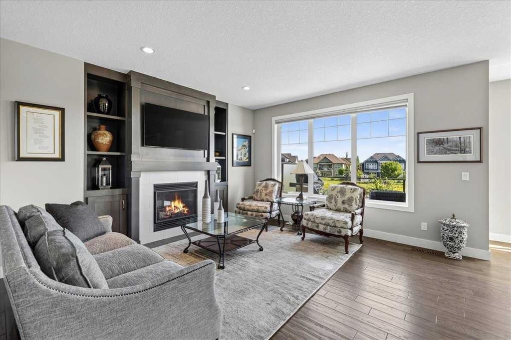 69 Cimarron Springs Circle, Okotoks, AB - Indoor Photo Showing Living Room With Fireplace