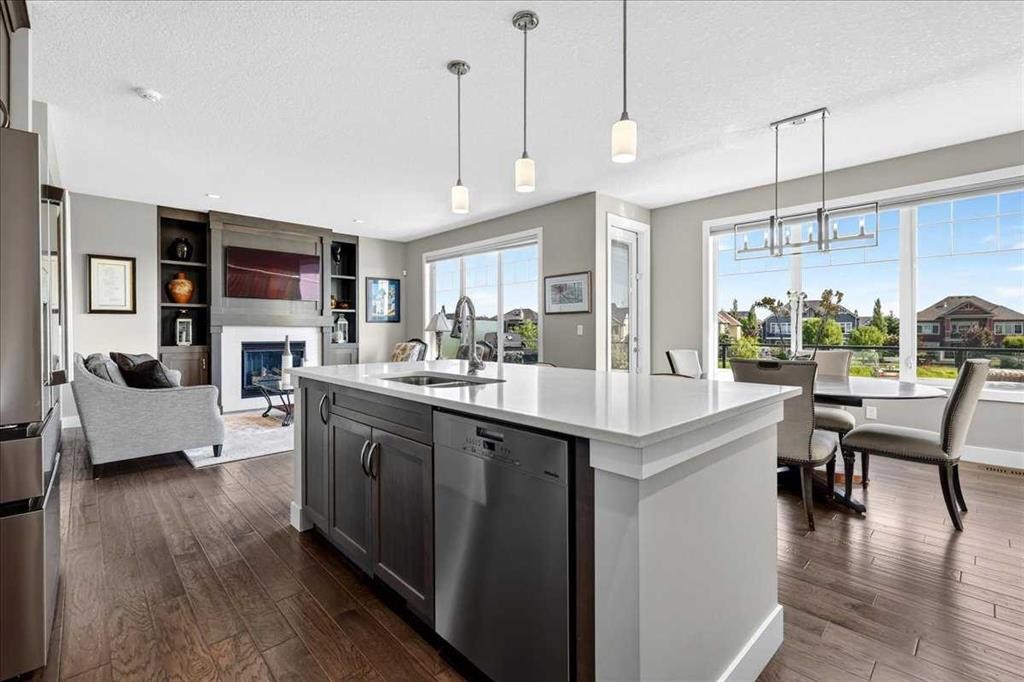 69 Cimarron Springs Circle, Okotoks, AB - Indoor Photo Showing Kitchen With Fireplace With Double Sink With Upgraded Kitchen