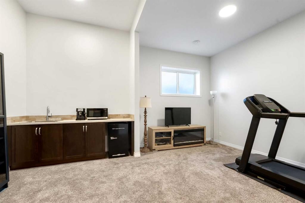 31 Magnolia Grove Se, Calgary, AB - Indoor Photo Showing Gym Room