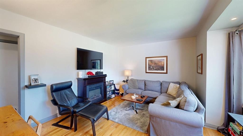5031 54 Avenue, Stavely, AB - Indoor Photo Showing Living Room With Fireplace