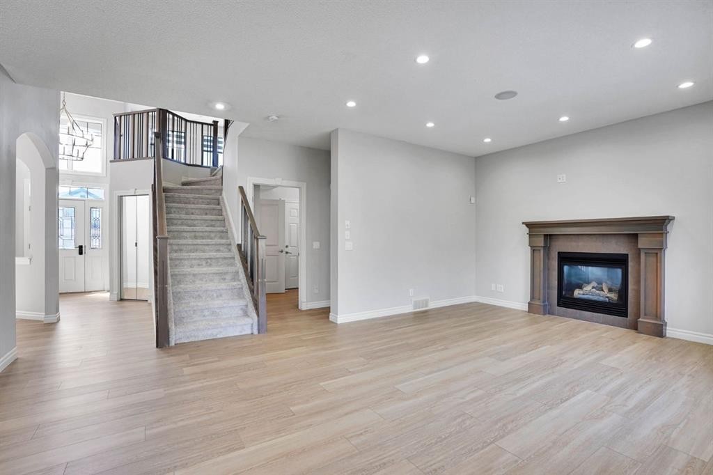 117 Hawkmere Place, Chestermere, AB - Indoor Photo Showing Living Room With Fireplace