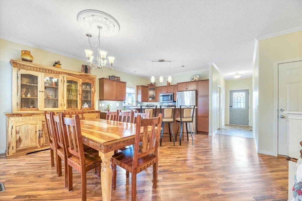 141 Ridgestone Lane, Diamond Valley, AB - Indoor Photo Showing Dining Room