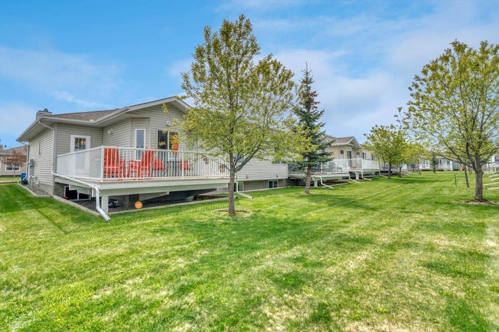 141 Ridgestone Lane, Diamond Valley, AB - Outdoor With Deck Patio Veranda