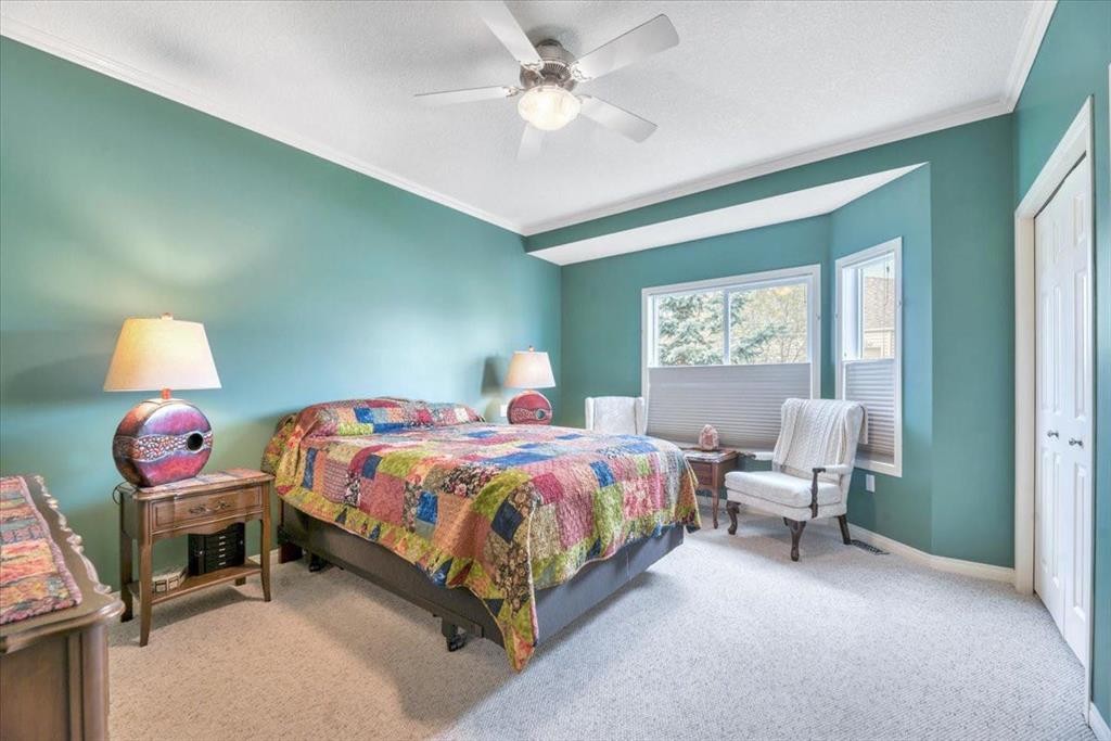 141 Ridgestone Lane, Diamond Valley, AB - Indoor Photo Showing Bedroom