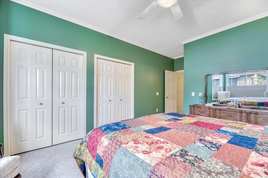141 Ridgestone Lane, Diamond Valley, AB - Indoor Photo Showing Bedroom