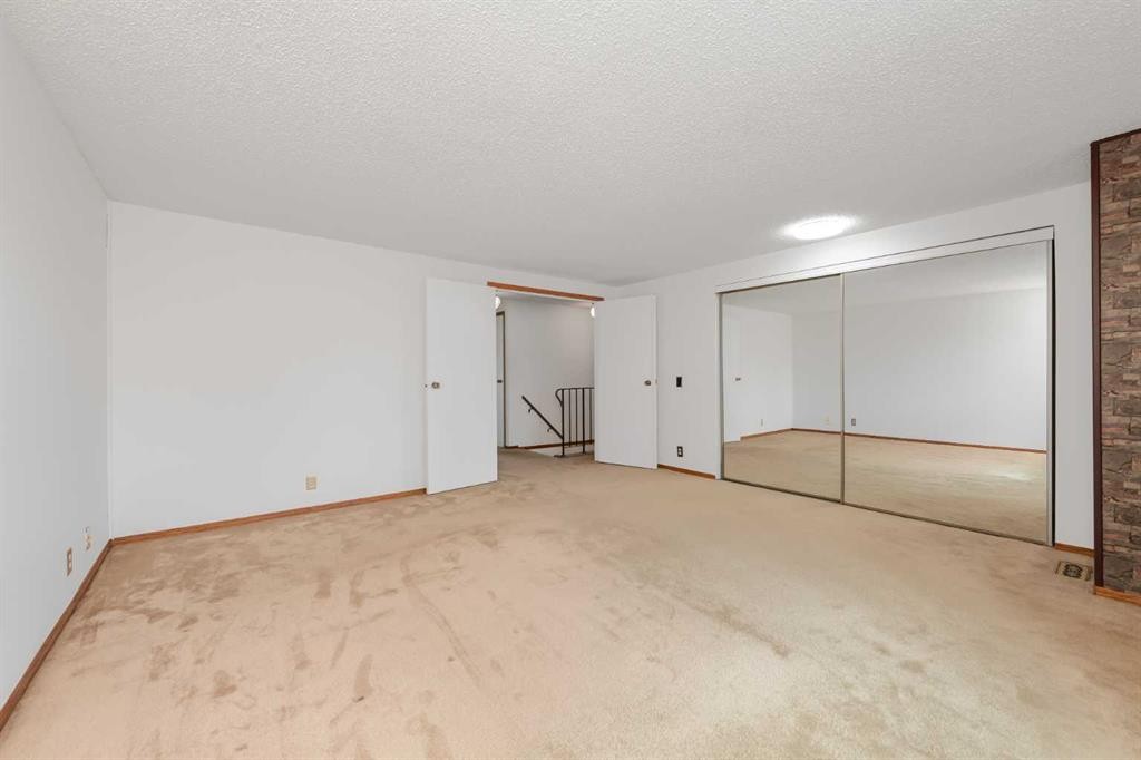78 Queen Anne Close Se, Calgary, AB - Indoor Photo Showing Other Room