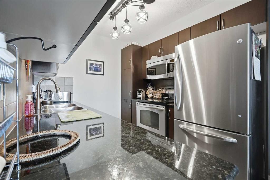 2409-60 Panatella Street, Calgary, AB - Indoor Photo Showing Kitchen With Stainless Steel Kitchen With Double Sink