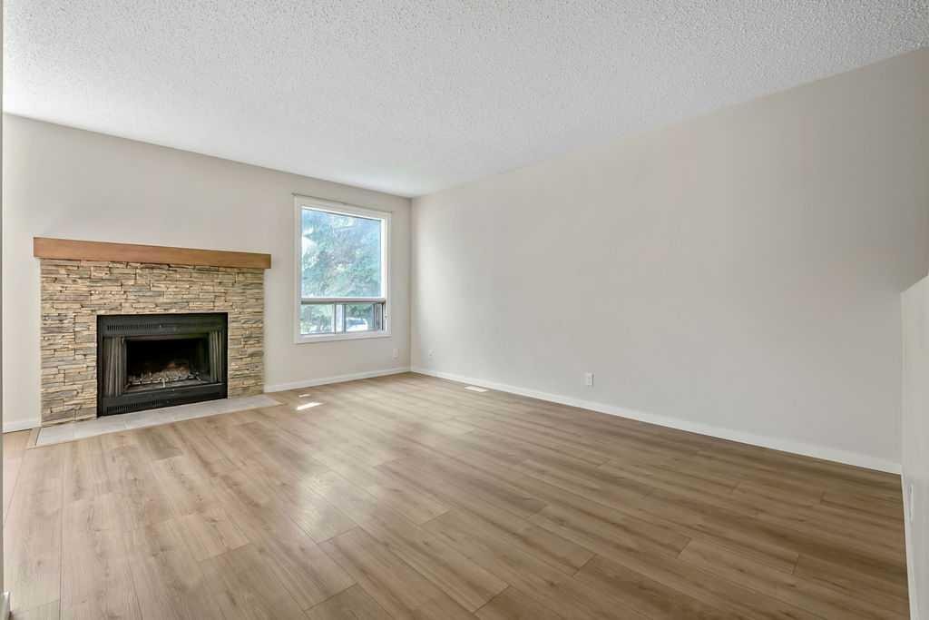 122 Bergen Road Nw, Calgary, AB - Indoor Photo Showing Living Room With Fireplace