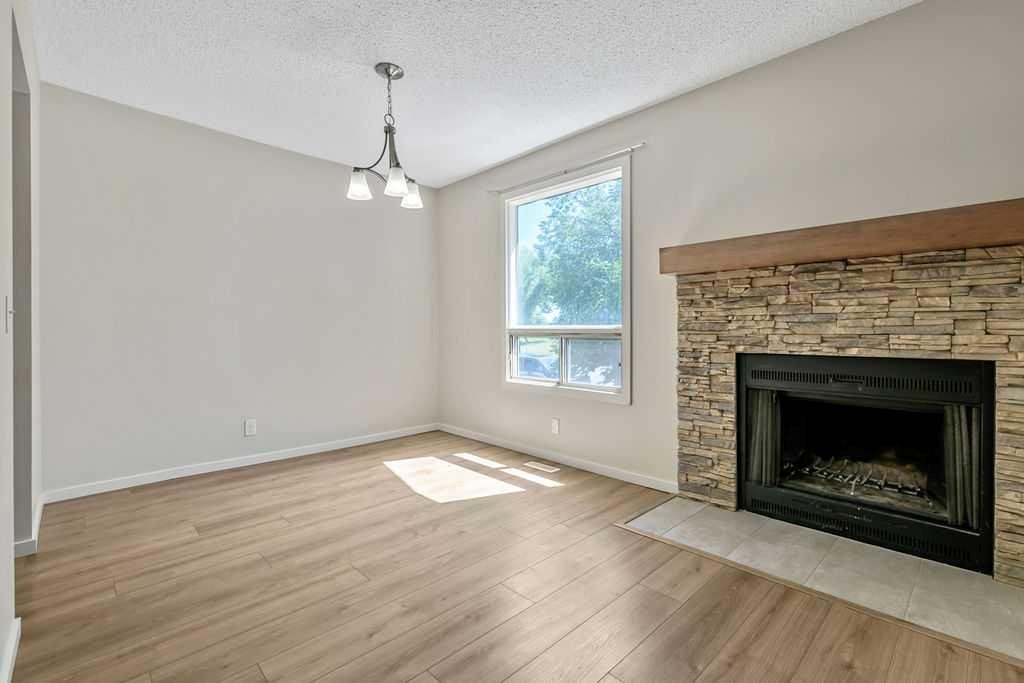 122 Bergen Road Nw, Calgary, AB - Indoor Photo Showing Living Room With Fireplace