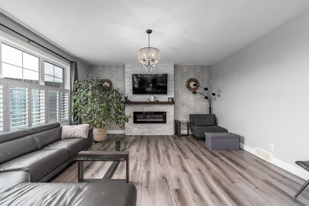 46 Yorkstone Way Sw, Calgary, AB - Indoor Photo Showing Living Room With Fireplace
