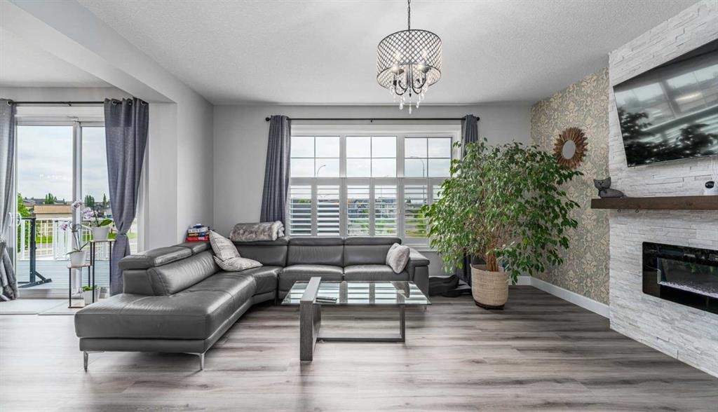 46 Yorkstone Way Sw, Calgary, AB - Indoor Photo Showing Living Room With Fireplace
