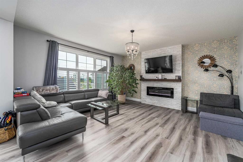 46 Yorkstone Way Sw, Calgary, AB - Indoor Photo Showing Living Room With Fireplace