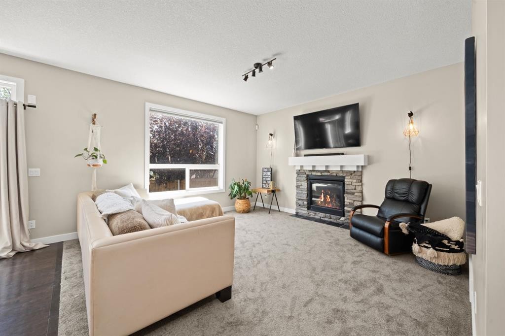172 Mcivor Terrace, Chestermere, AB - Indoor Photo Showing Living Room With Fireplace