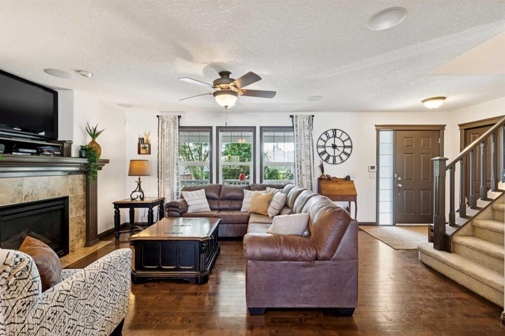 316 Prestwick Terrace Se, Calgary, AB - Indoor Photo Showing Living Room With Fireplace