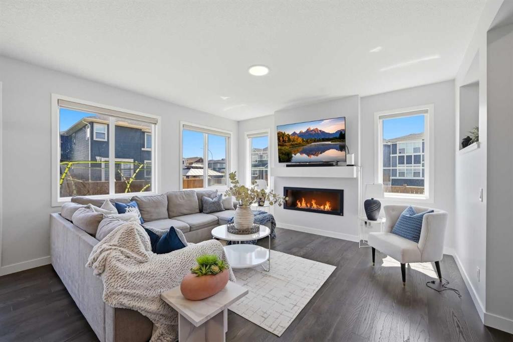 114 Corner Meadows Grove Ne, Calgary, AB - Indoor Photo Showing Living Room With Fireplace