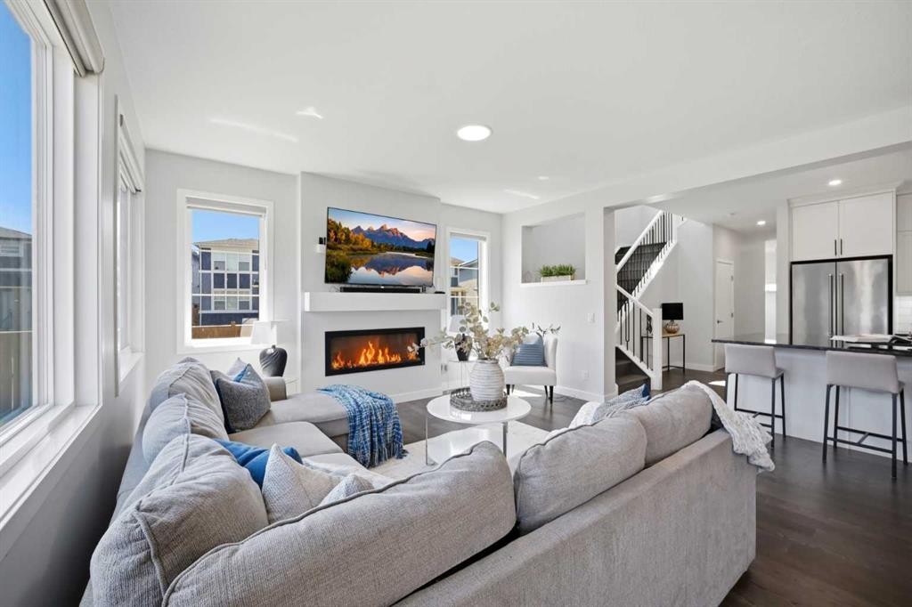 114 Corner Meadows Grove Ne, Calgary, AB - Indoor Photo Showing Living Room With Fireplace