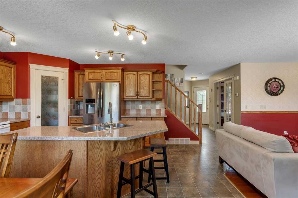 84 Willowbrook Crescent Nw, Airdrie, AB - Indoor Photo Showing Kitchen With Double Sink