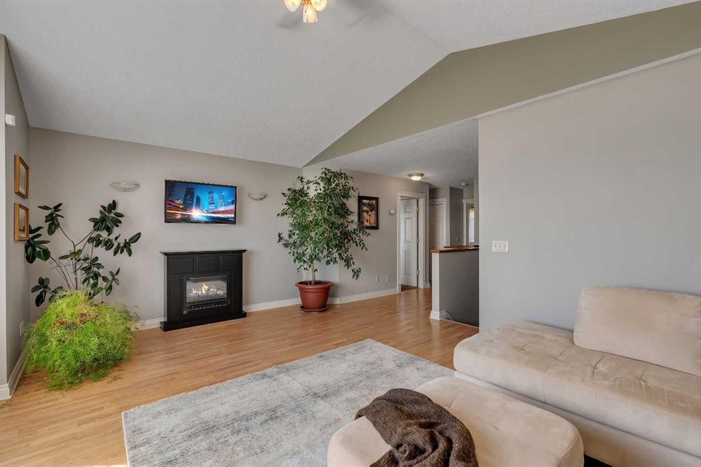 84 Willowbrook Crescent Nw, Airdrie, AB - Indoor Photo Showing Living Room With Fireplace