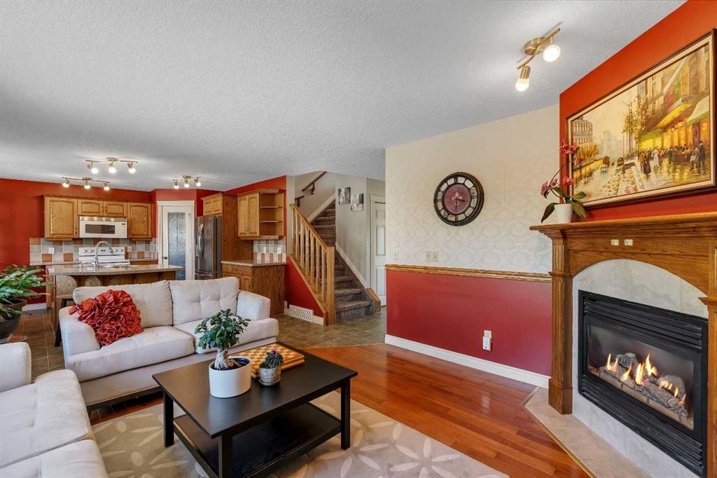 84 Willowbrook Crescent Nw, Airdrie, AB - Indoor Photo Showing Living Room With Fireplace