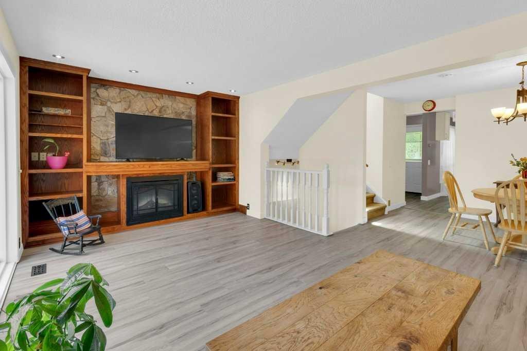 20 Midpark Gardens Se, Calgary, AB - Indoor With Fireplace